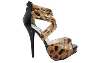 Printed cheeta heel with a 5.5 heel and a 1 platform.Criss crossed 