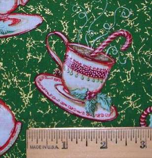   gold squiggles, teacups and mugs of hot cocoa with peppermint sticks